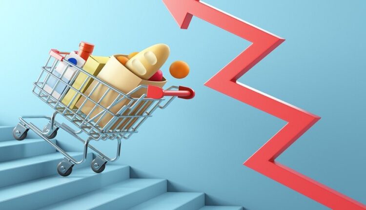 shopping cart full of food and red success arrow sign on stairs